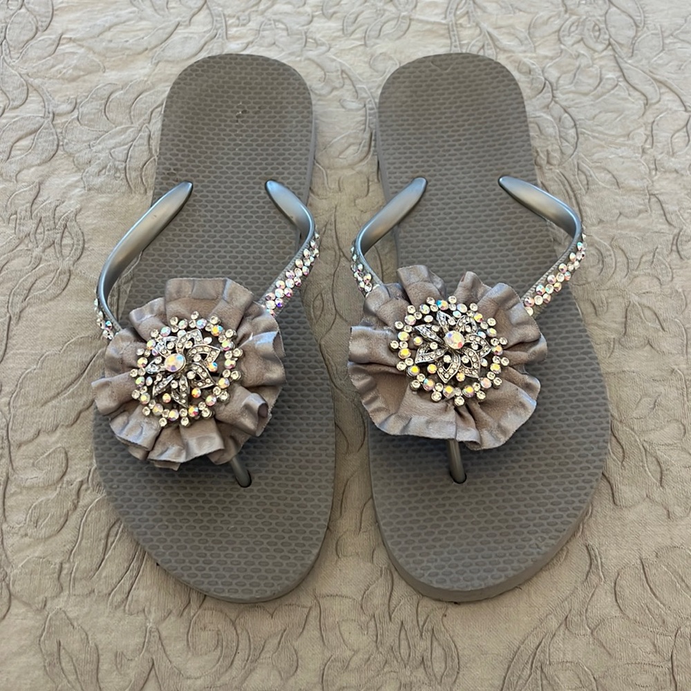 Silver/gray flip flops